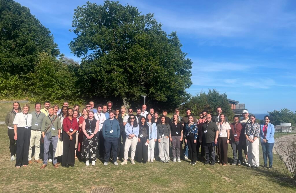 Group photo of the O-GlcNAc-NDD 2026 participants outside the Fuglsø conference center